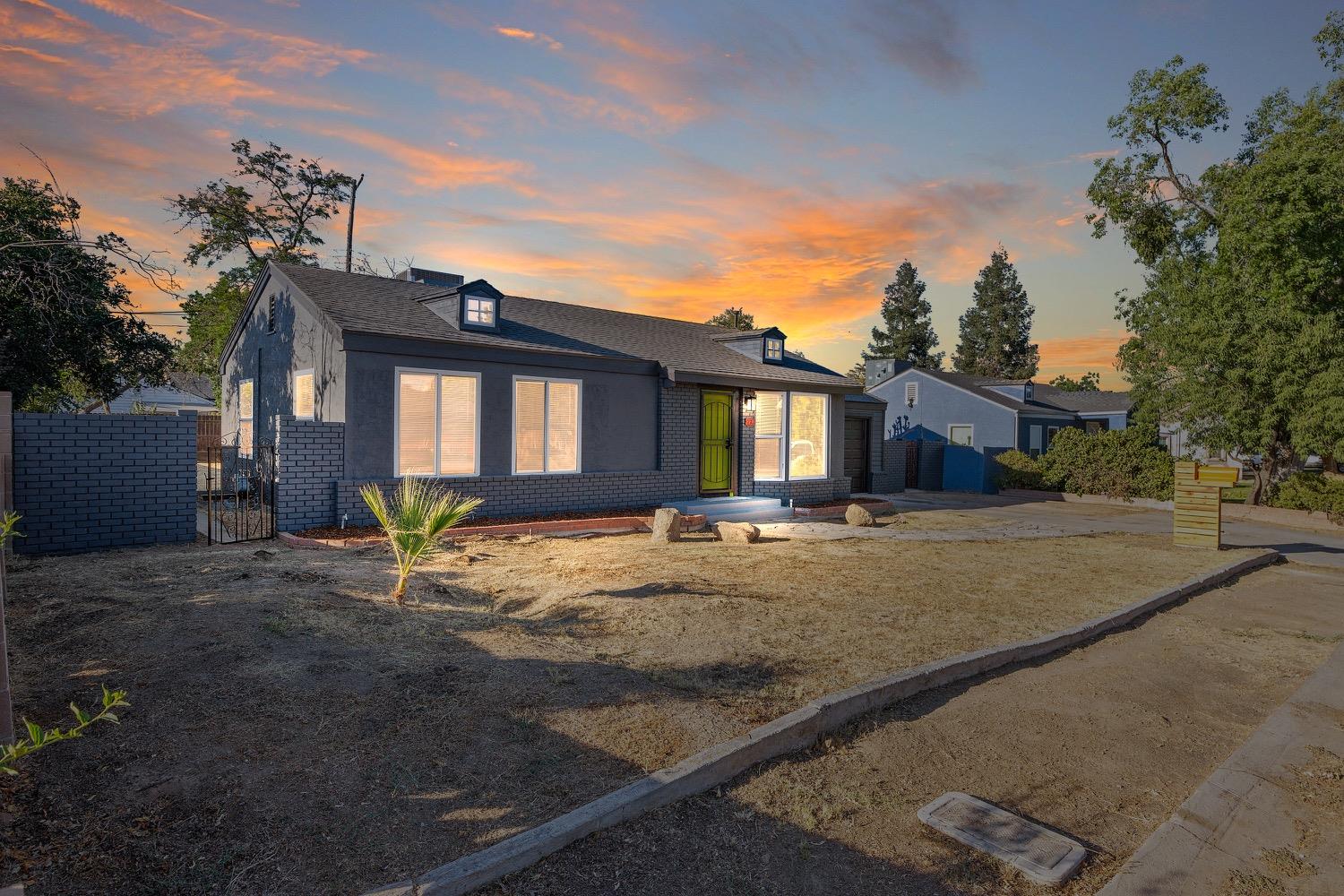 71 East Griffith Way Fresno, CA 93704 - Photo 3 of 35 a view of a house with a yard