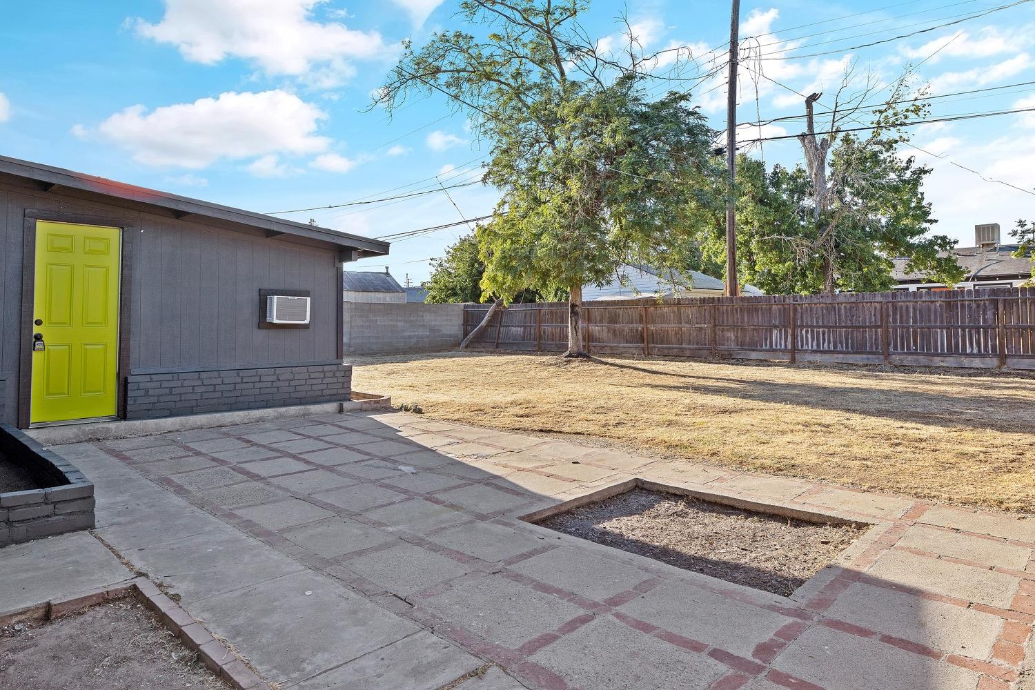 71 East Griffith Way Fresno, CA 93704 - Photo 32 of 35 a house view with a swimming pool
