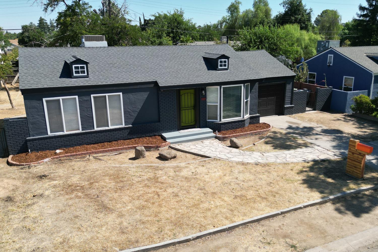 71 East Griffith Way Fresno, CA 93704 - Photo 33 of 35 a view of house with yard