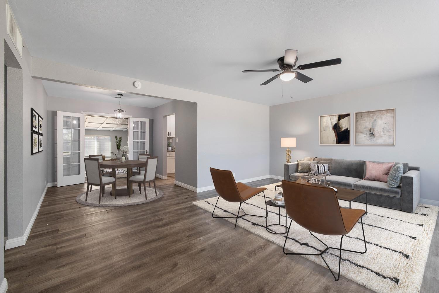 71 East Griffith Way Fresno, CA 93704 - Photo 5 of 35 a living room with furniture a dining table and a potted plant
