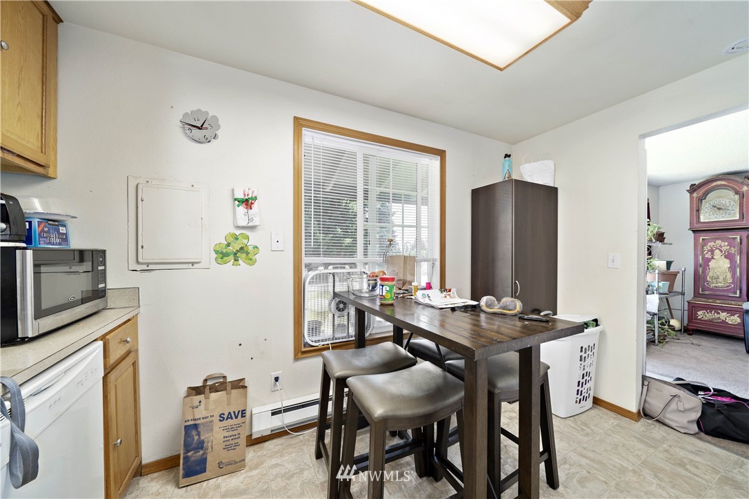 6028 Rockefeller Avenue Everett, WA 98203 - Photo 12 of 25 a view of a dining room with furniture window and outside view