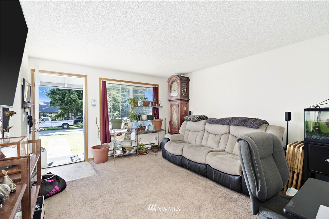 6028 Rockefeller Avenue Everett, WA 98203 - Photo 14 of 25 a bedroom with furniture and a large window