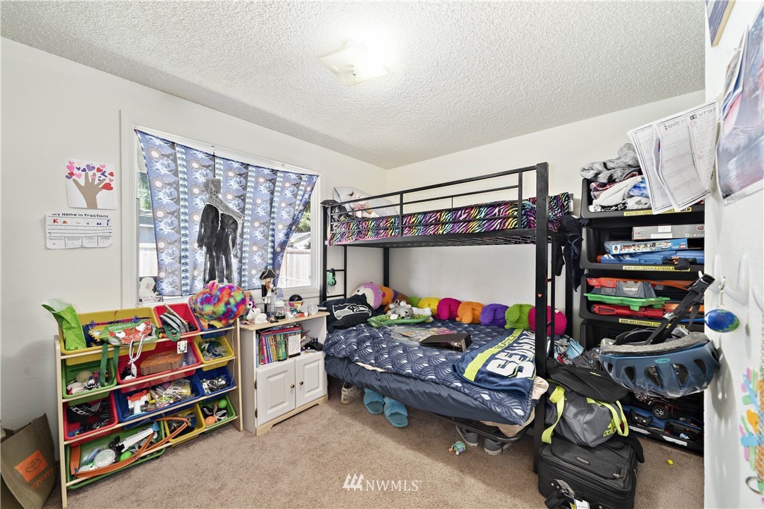 6028 Rockefeller Avenue Everett, WA 98203 - Photo 17 of 25 a bedroom with furniture and a bed