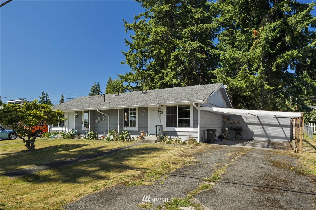 6028 Rockefeller Avenue Everett, WA 98203 - Photo 25 of 25 a view of a white house with a outdoor space