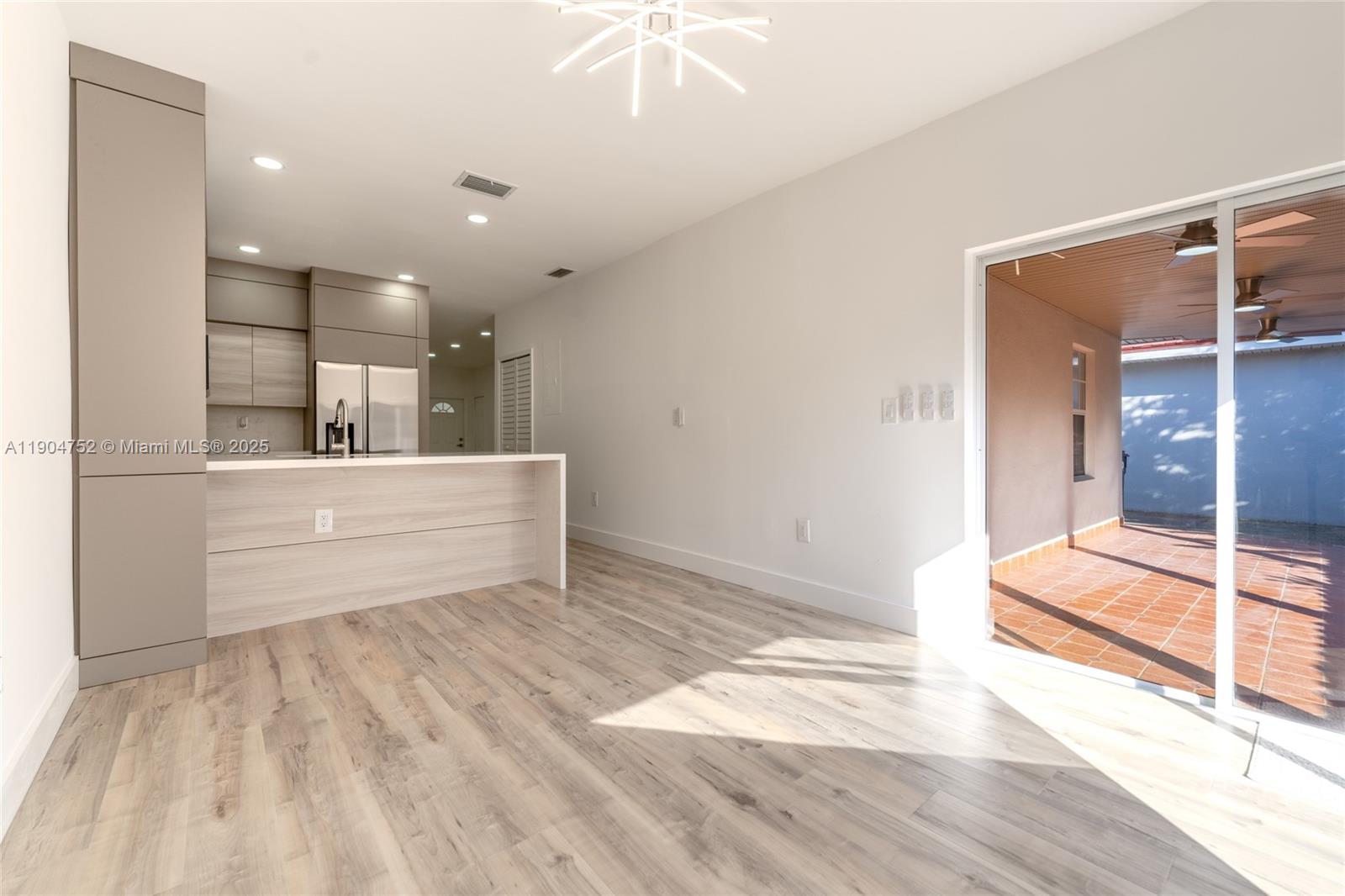 14231 Southwest 147th Place Miami, FL 33196 - Photo 18 of 35 a view of a kitchen with a sink and cabinets