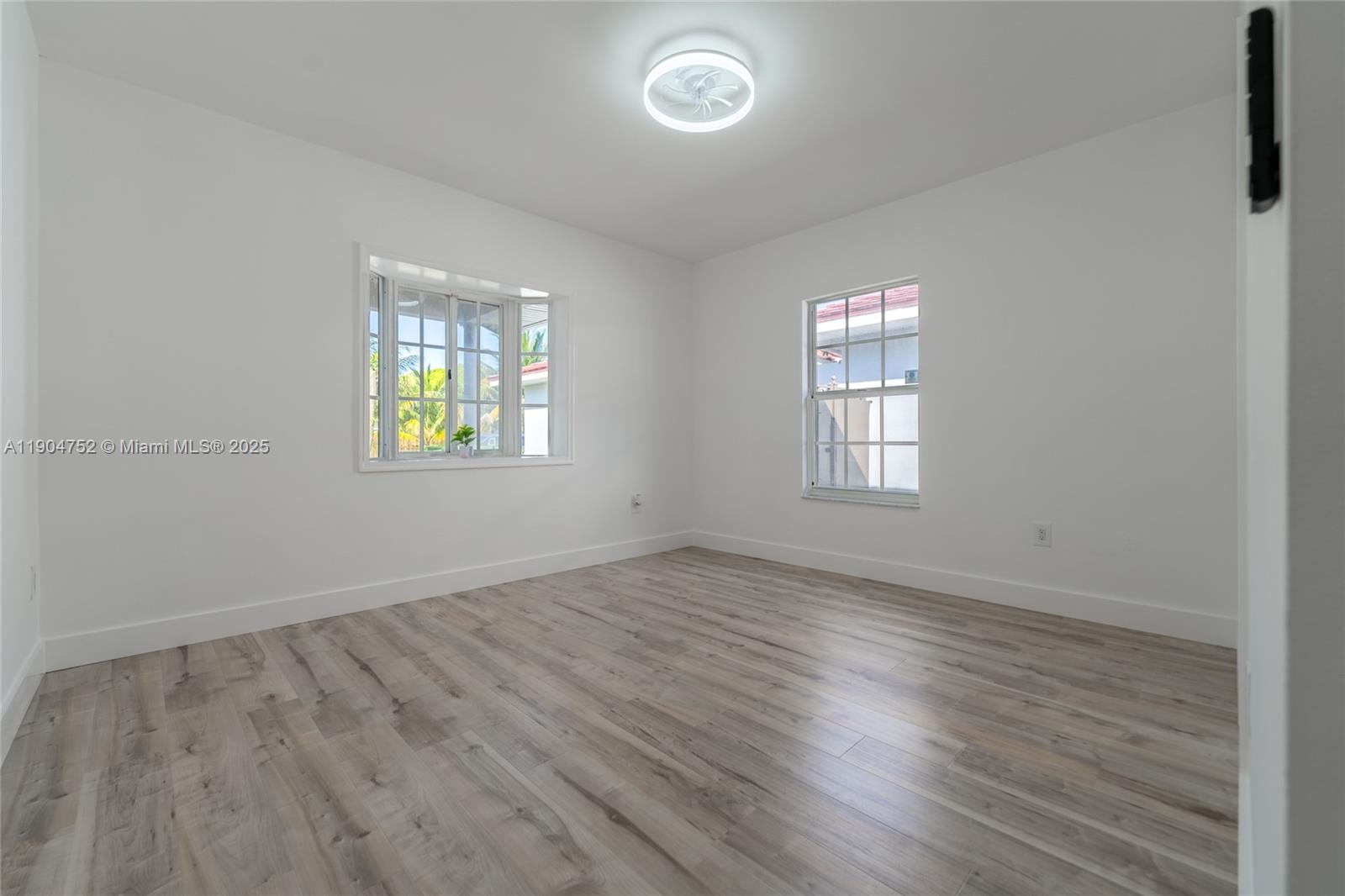 14231 Southwest 147th Place Miami, FL 33196 - Photo 19 of 35 an empty room with windows