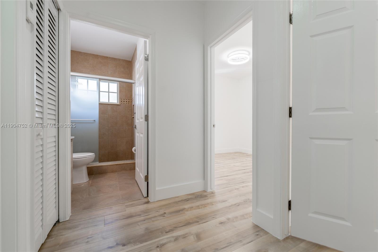 14231 Southwest 147th Place Miami, FL 33196 - Photo 23 of 35 a view of a bathroom from a hallway