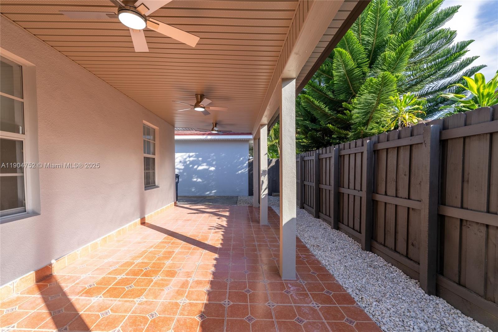 14231 Southwest 147th Place Miami, FL 33196 - Photo 29 of 35 a view of a porch with wooden floor