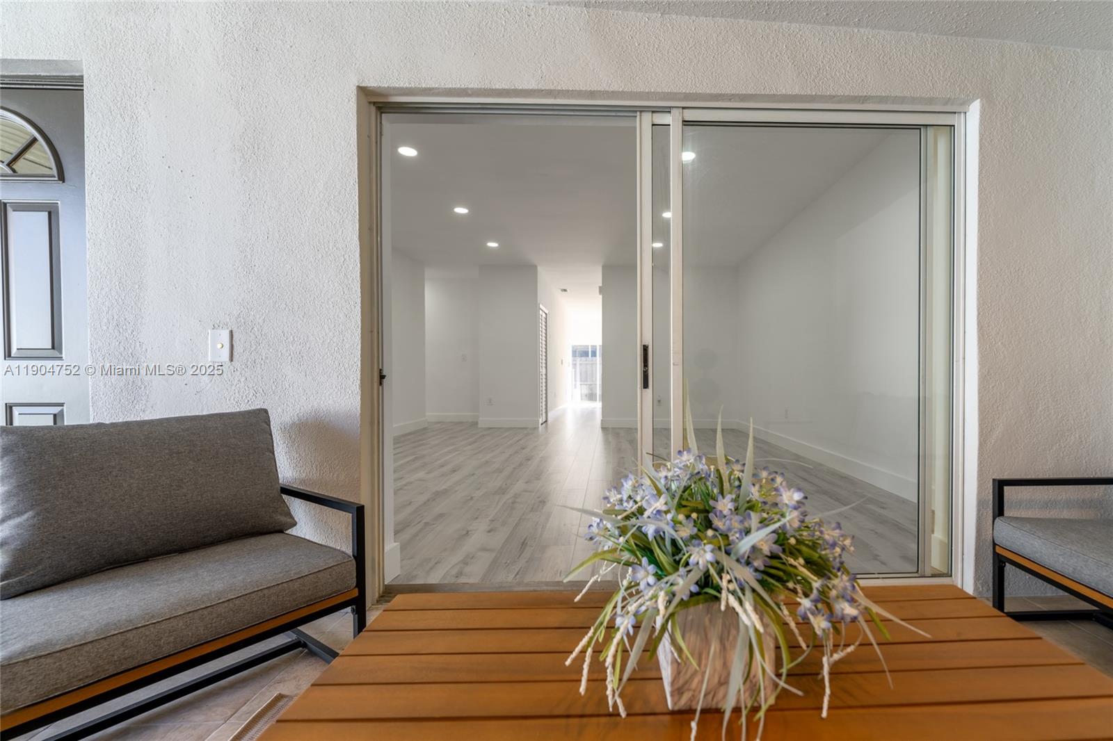 14231 Southwest 147th Place Miami, FL 33196 - Photo 31 of 35 a living room with furniture and a potted plant
