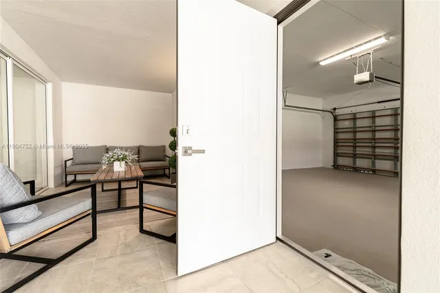 a view of empty room with ceiling fan