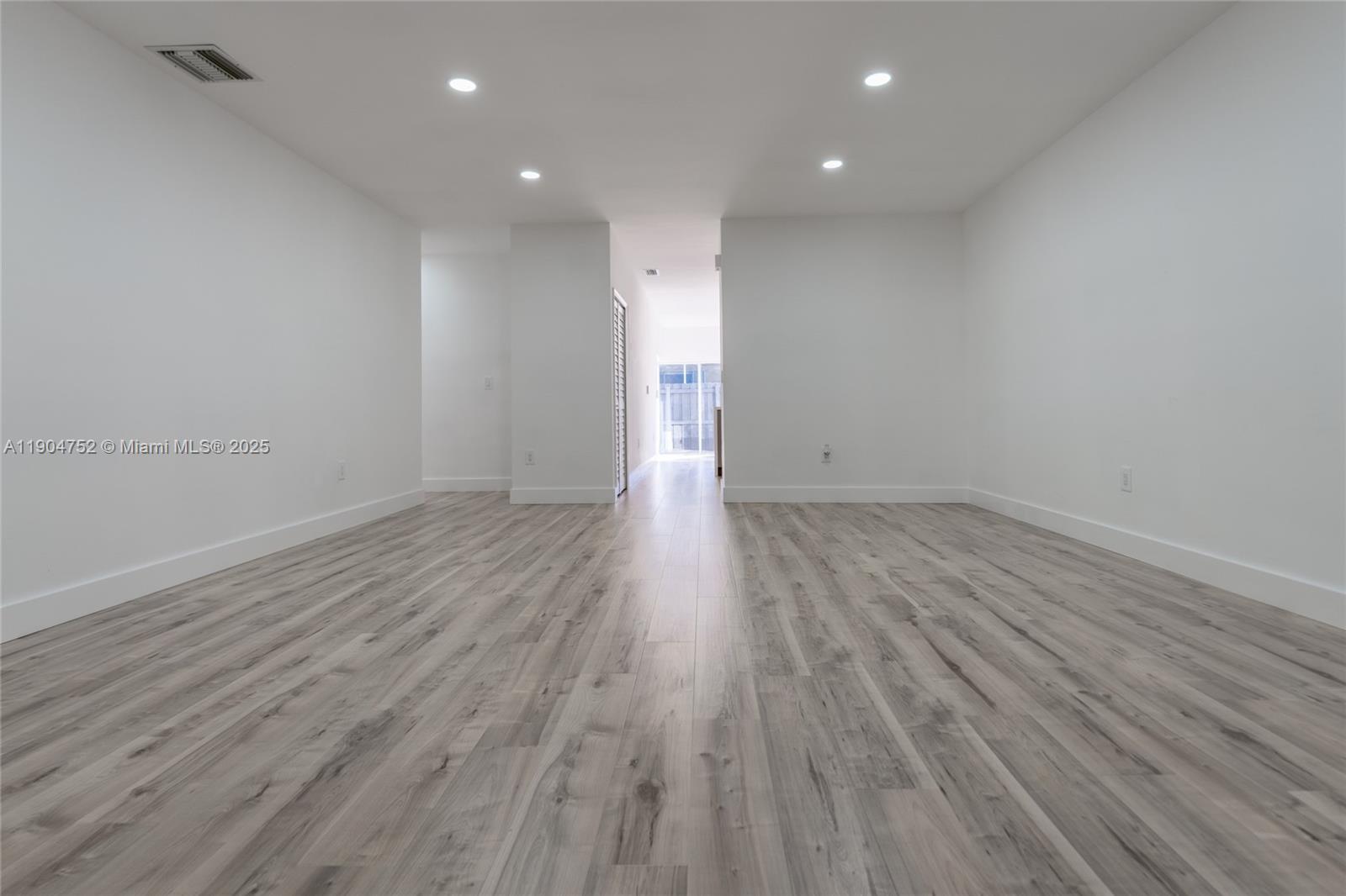14231 Southwest 147th Place Miami, FL 33196 - Photo 9 of 35 a view of room with wooden floor and window