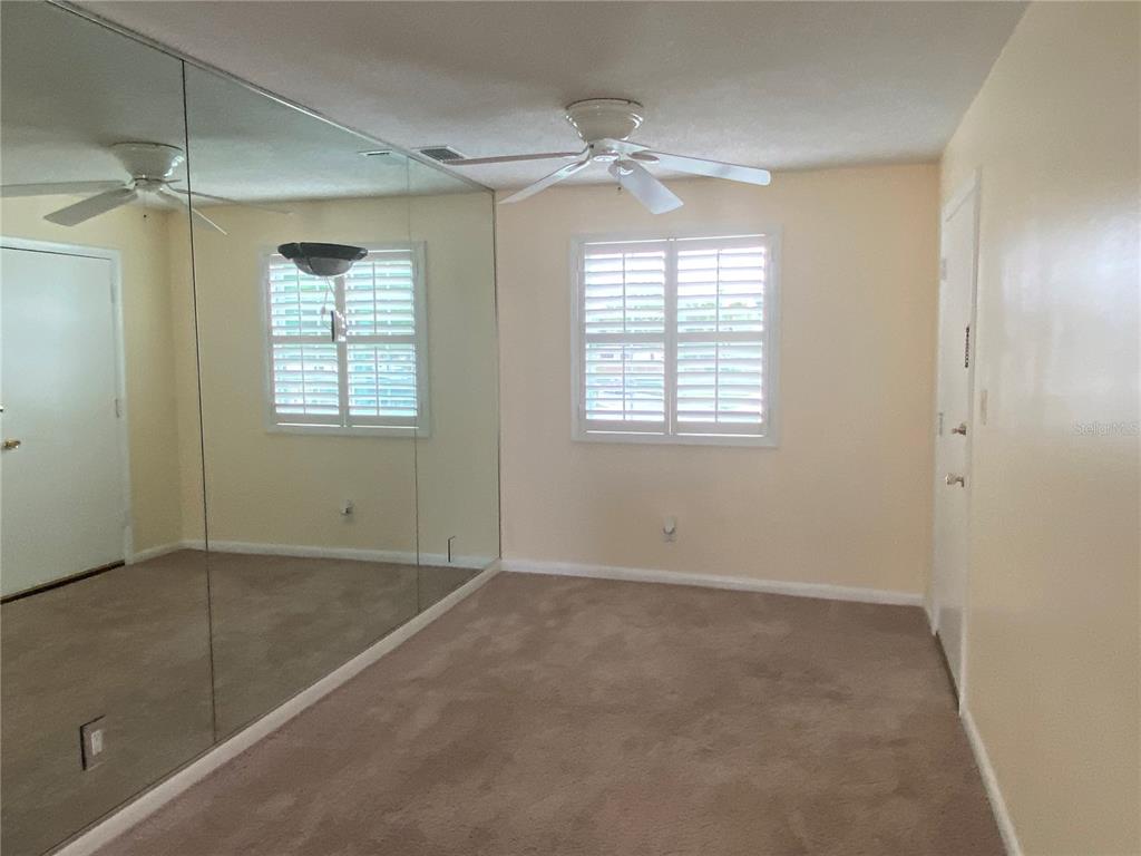 1500 Gay Road, Unit 17D Winter Park, FL 32789 - Photo 9 of 34 a view of an empty room with a window