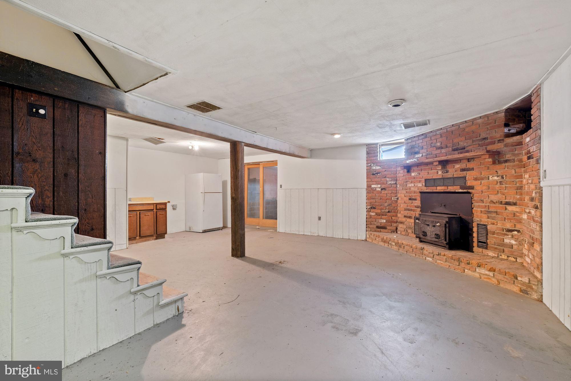 356 Barnhart Road Westminster, MD 21158 - Photo 27 of 33 Unfinished basement with fireplace