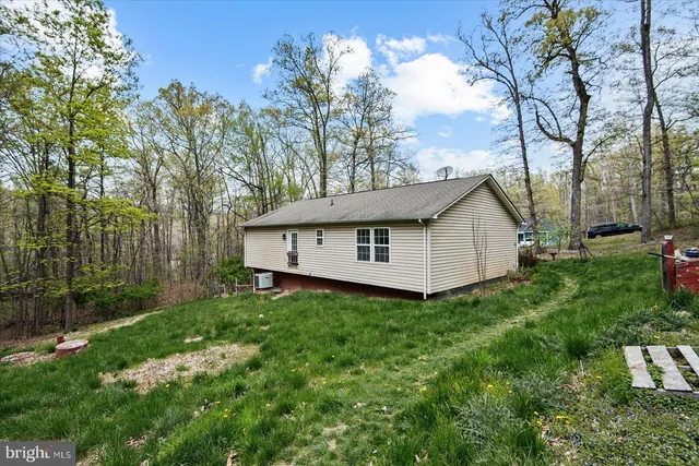 a backyard of a house with lots of green space