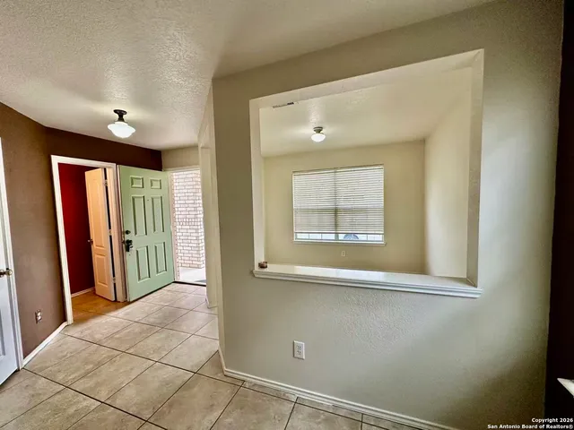 a view of a hallway with windows