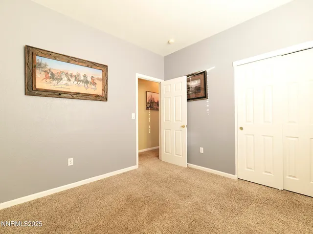 a room with a window and a ceiling fan