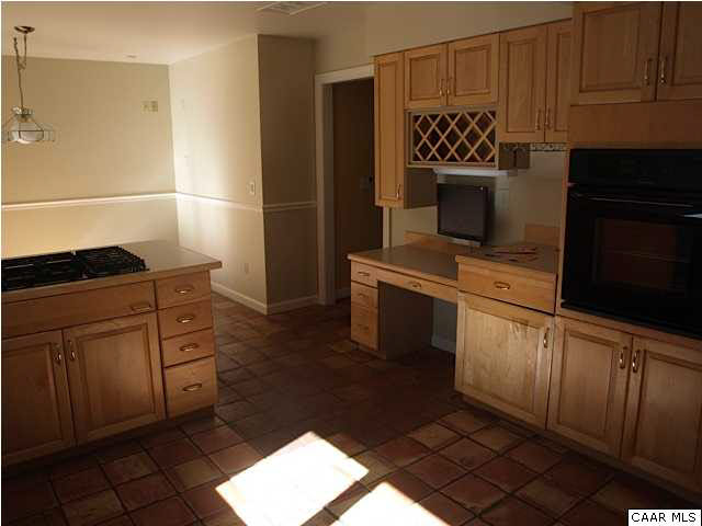 660 Gillums Ridge Road Charlottesville, VA 22903 - Photo 8 of 36 a kitchen with a refrigerator sink and cabinets