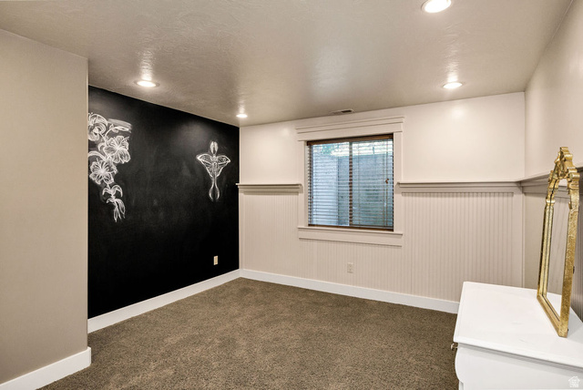 288 525 South Providence, UT 84332 - Photo 38 of 71 Carpeted room featuring a blackboard accent wall, recessed ceiling lighting, and a window with blinds