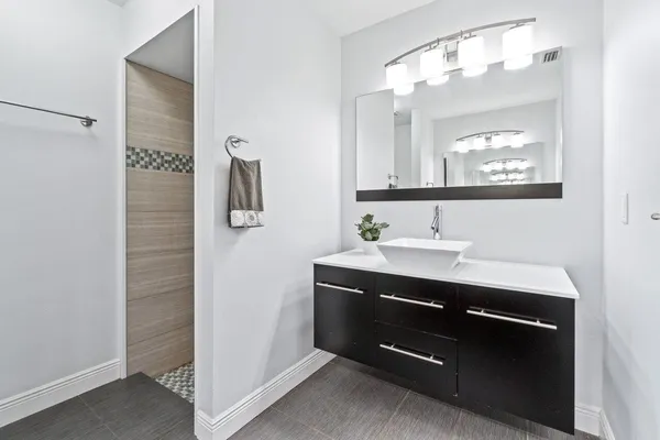 a bathroom with a sink and a mirror