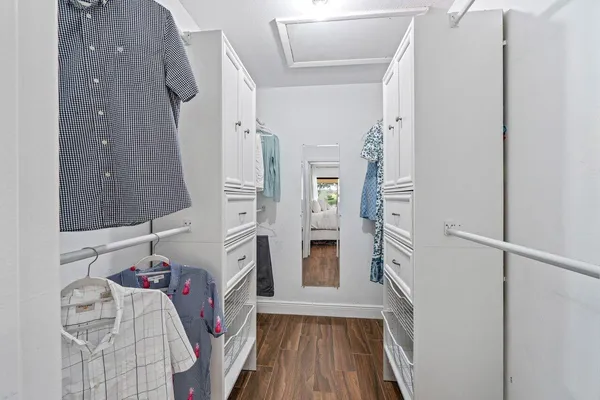a view of living room with furniture and wooden floor