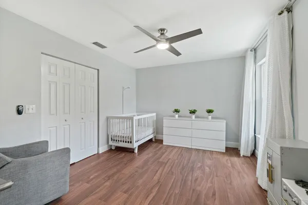 a view of a livingroom with furniture and a window