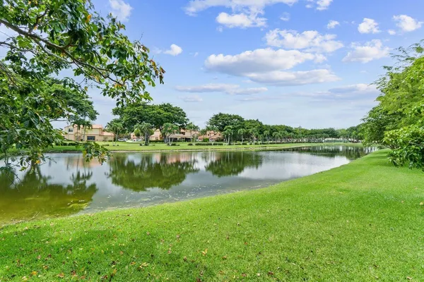 a view of a lake with houses in the background