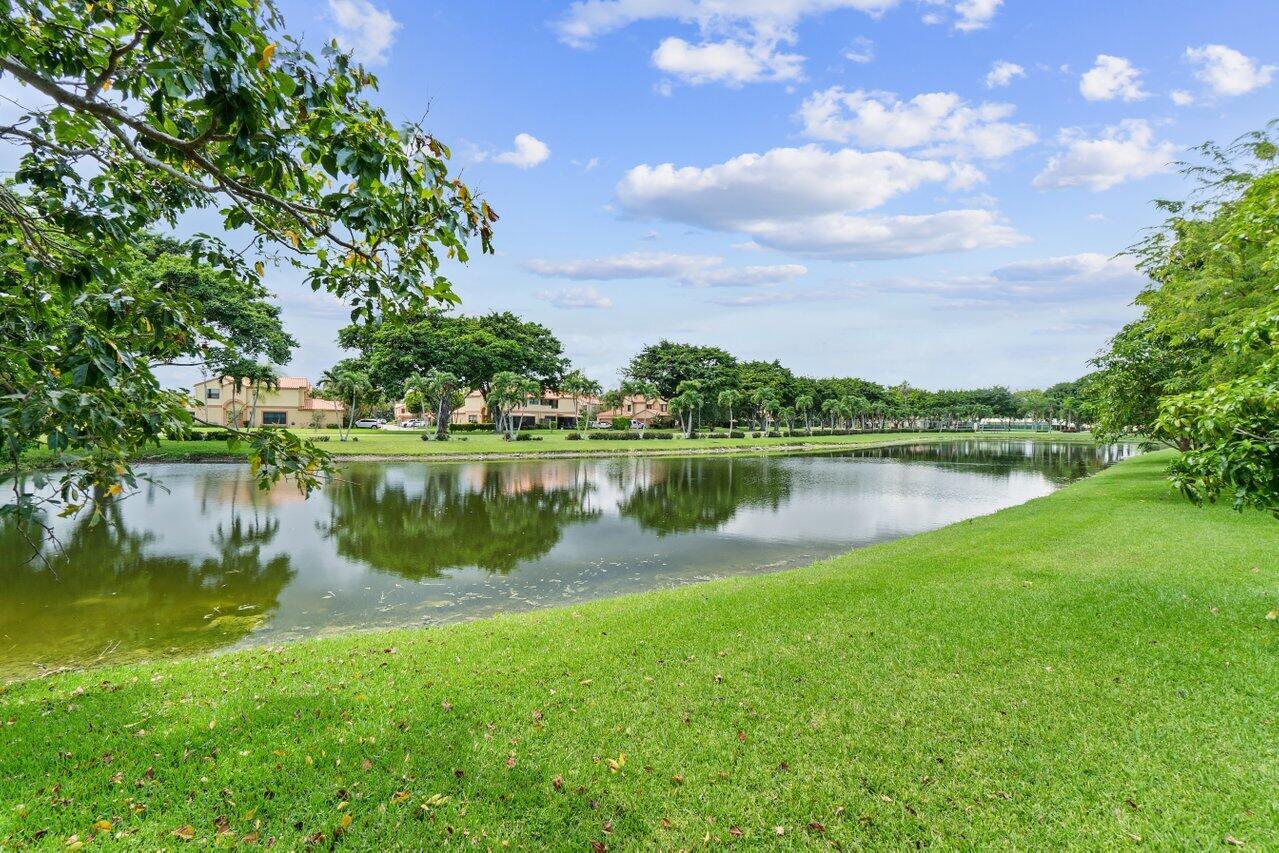 19977 Villa Medici Place Boca Raton, FL 33434 - Photo 28 of 33 a view of a lake with houses in the background