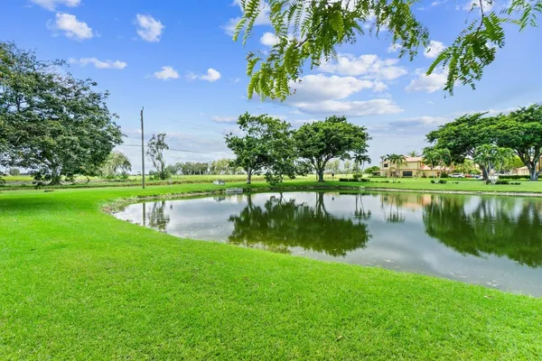 a view of a lake with a yard