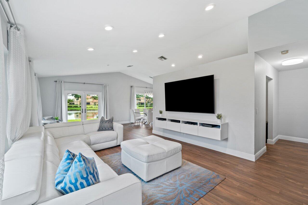 19977 Villa Medici Place Boca Raton, FL 33434 - Photo 6 of 33 a living room with furniture and a flat screen tv