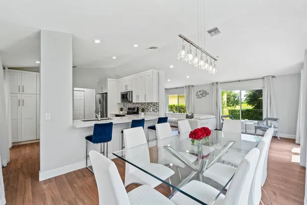 a view of kitchen dining table and chairs