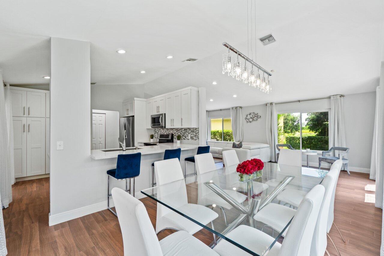 19977 Villa Medici Place Boca Raton, FL 33434 - Photo 9 of 33 a view of kitchen dining table and chairs