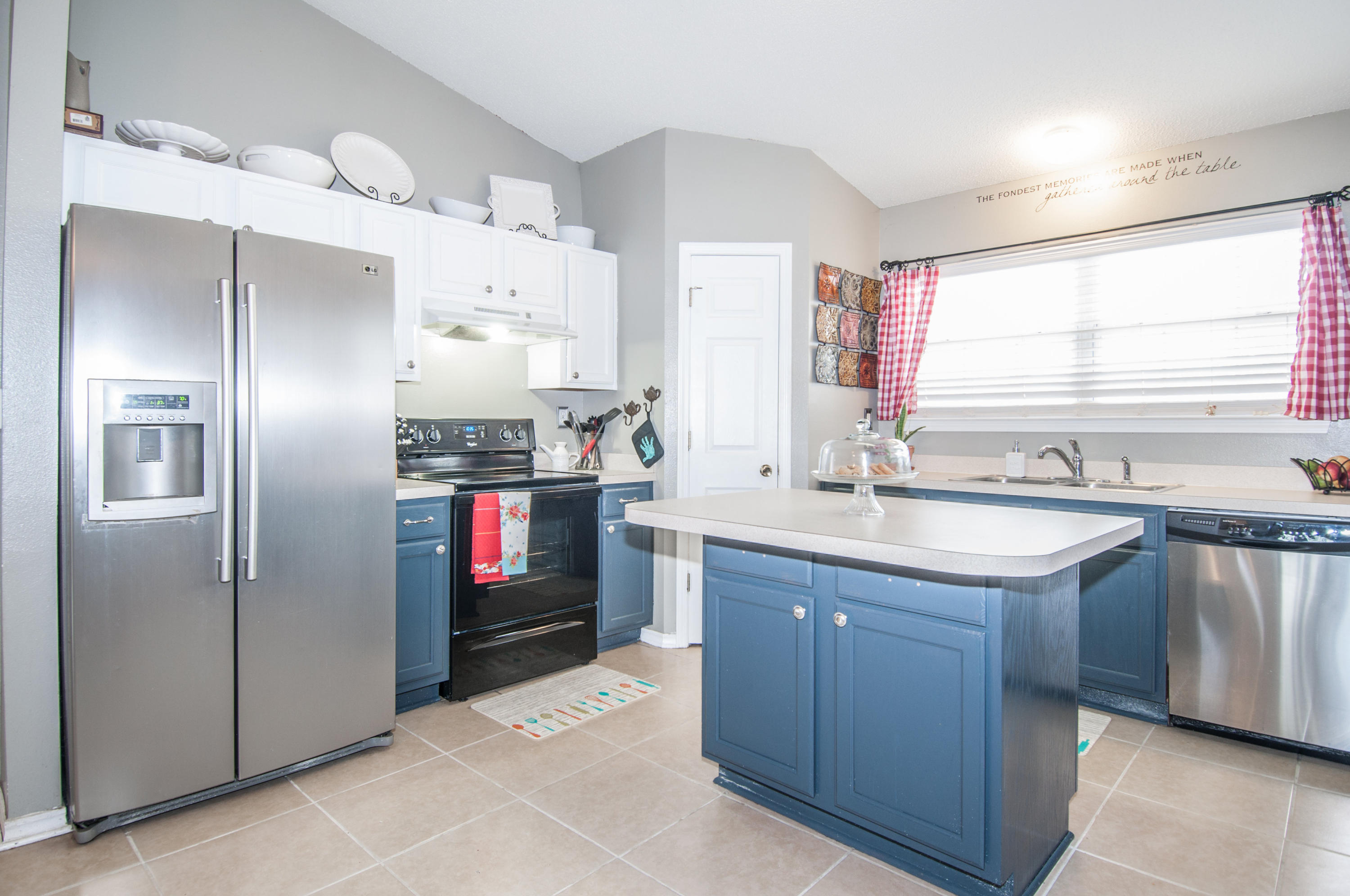 210 Limestone Circle Crestview, FL 32539 - Photo 12 of 54 a kitchen with stainless steel appliances granite countertop a refrigerator and a sink