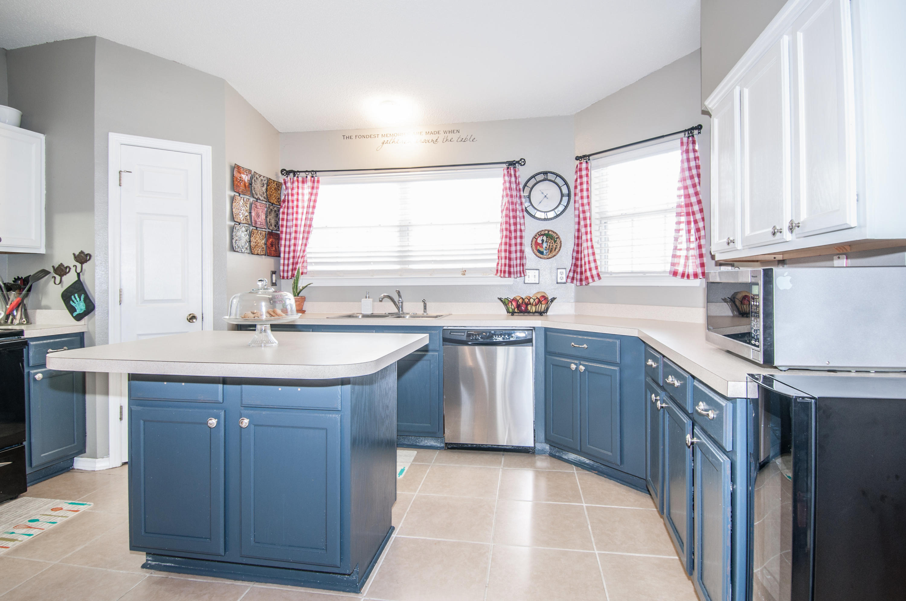 210 Limestone Circle Crestview, FL 32539 - Photo 13 of 54 a kitchen with a sink window and cabinets
