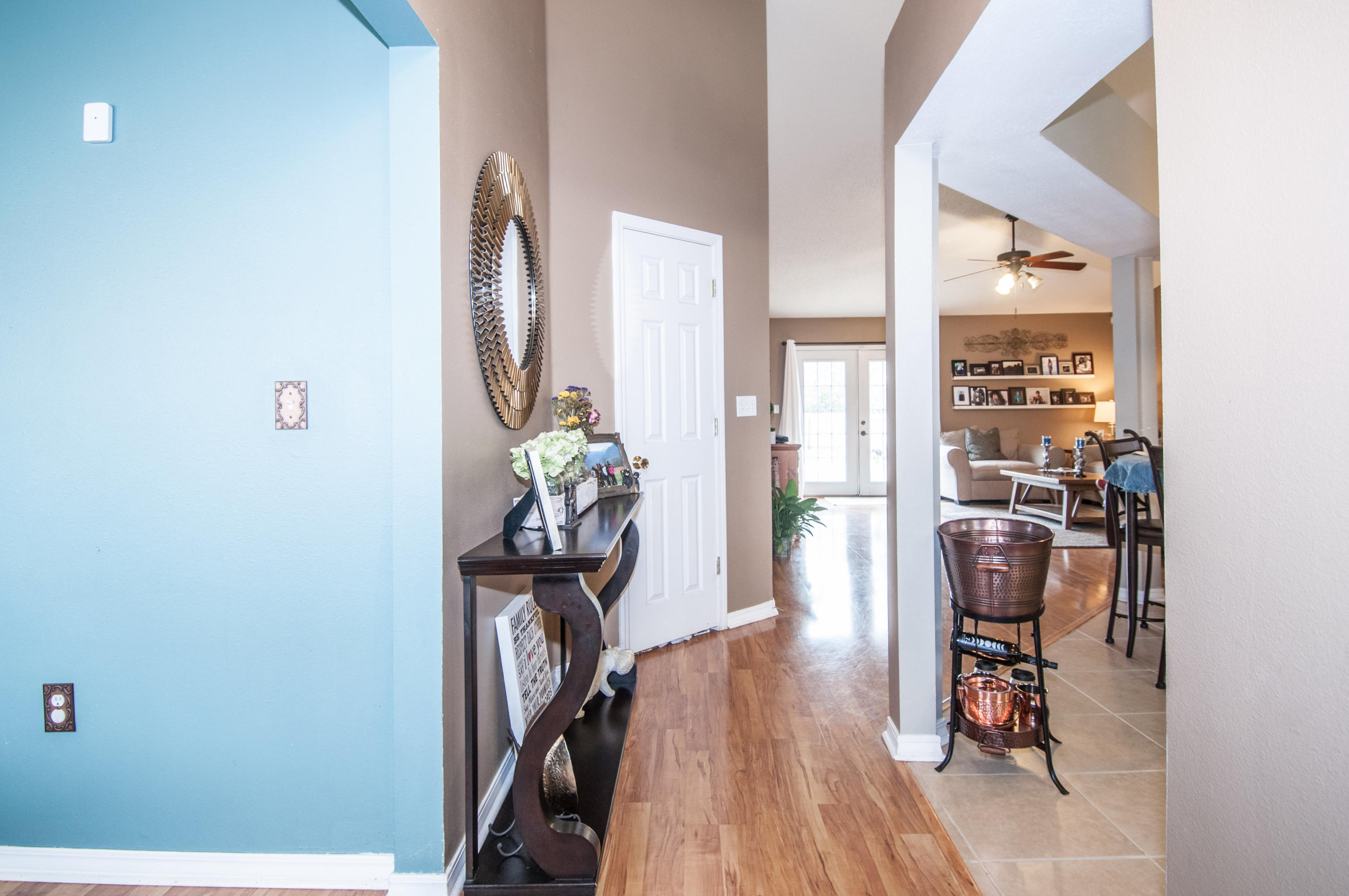 210 Limestone Circle Crestview, FL 32539 - Photo 21 of 54 a view of a hallway with furniture and wooden floor