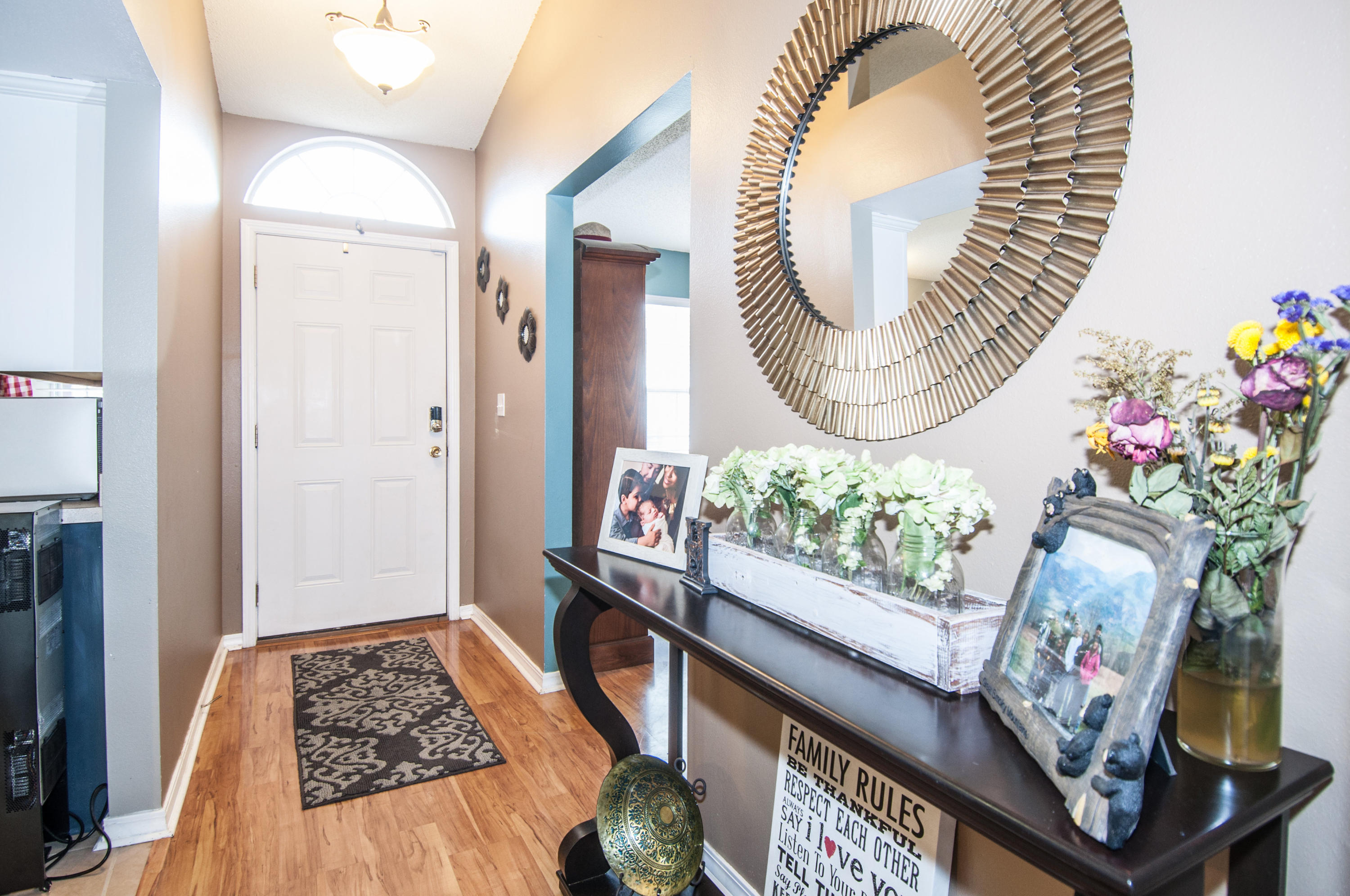 210 Limestone Circle Crestview, FL 32539 - Photo 22 of 54 an entryway with wooden floor and a rug