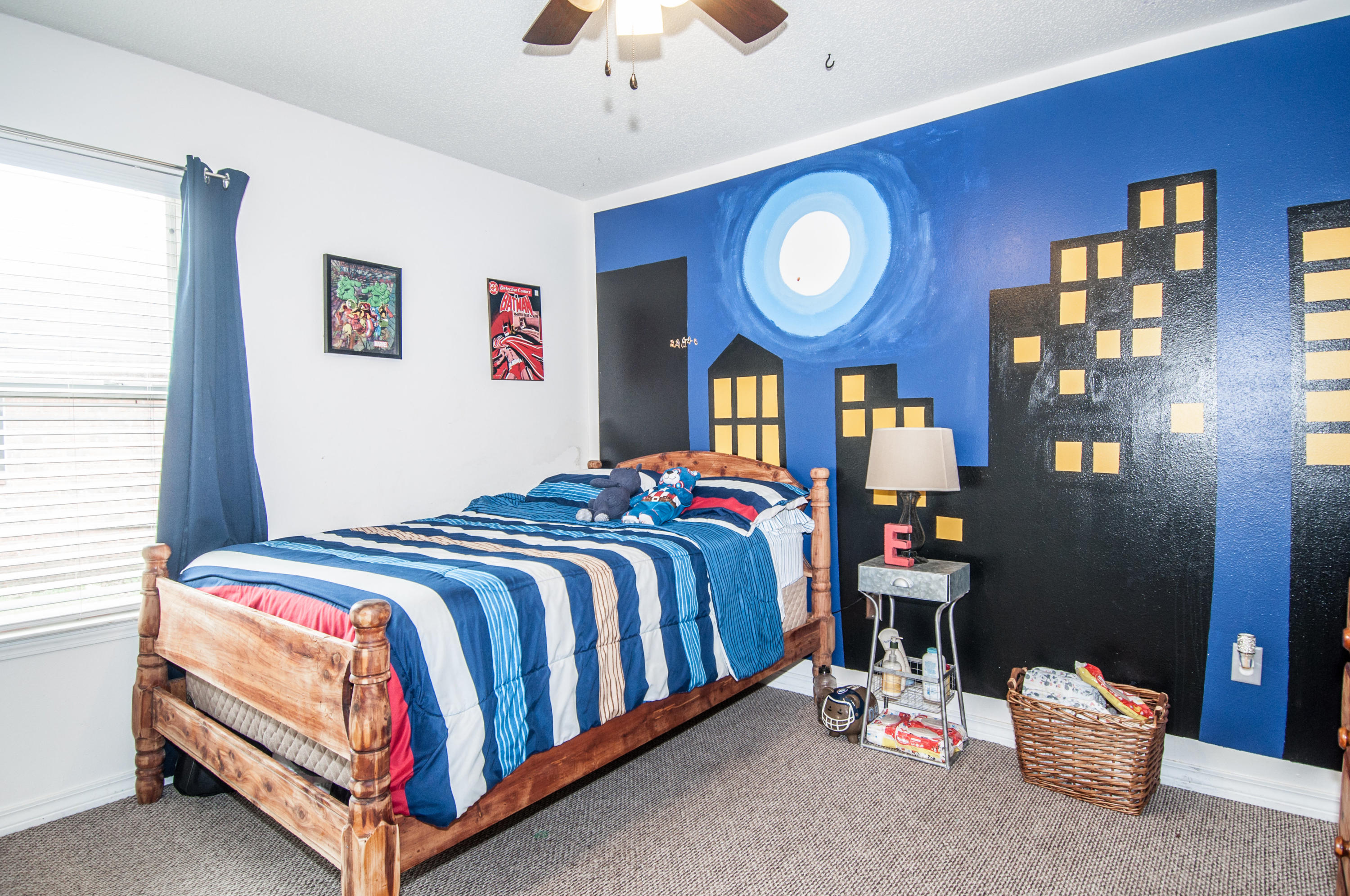210 Limestone Circle Crestview, FL 32539 - Photo 28 of 54 a bedroom with a bed and a chandelier