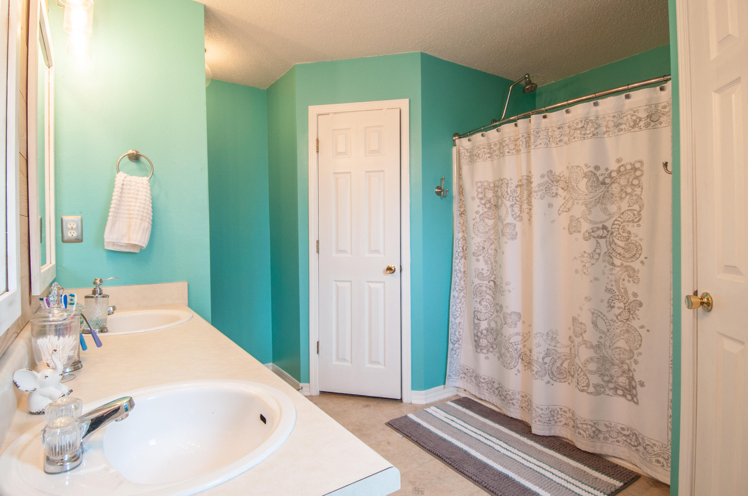 210 Limestone Circle Crestview, FL 32539 - Photo 46 of 54 a bathroom with a sink and a mirror