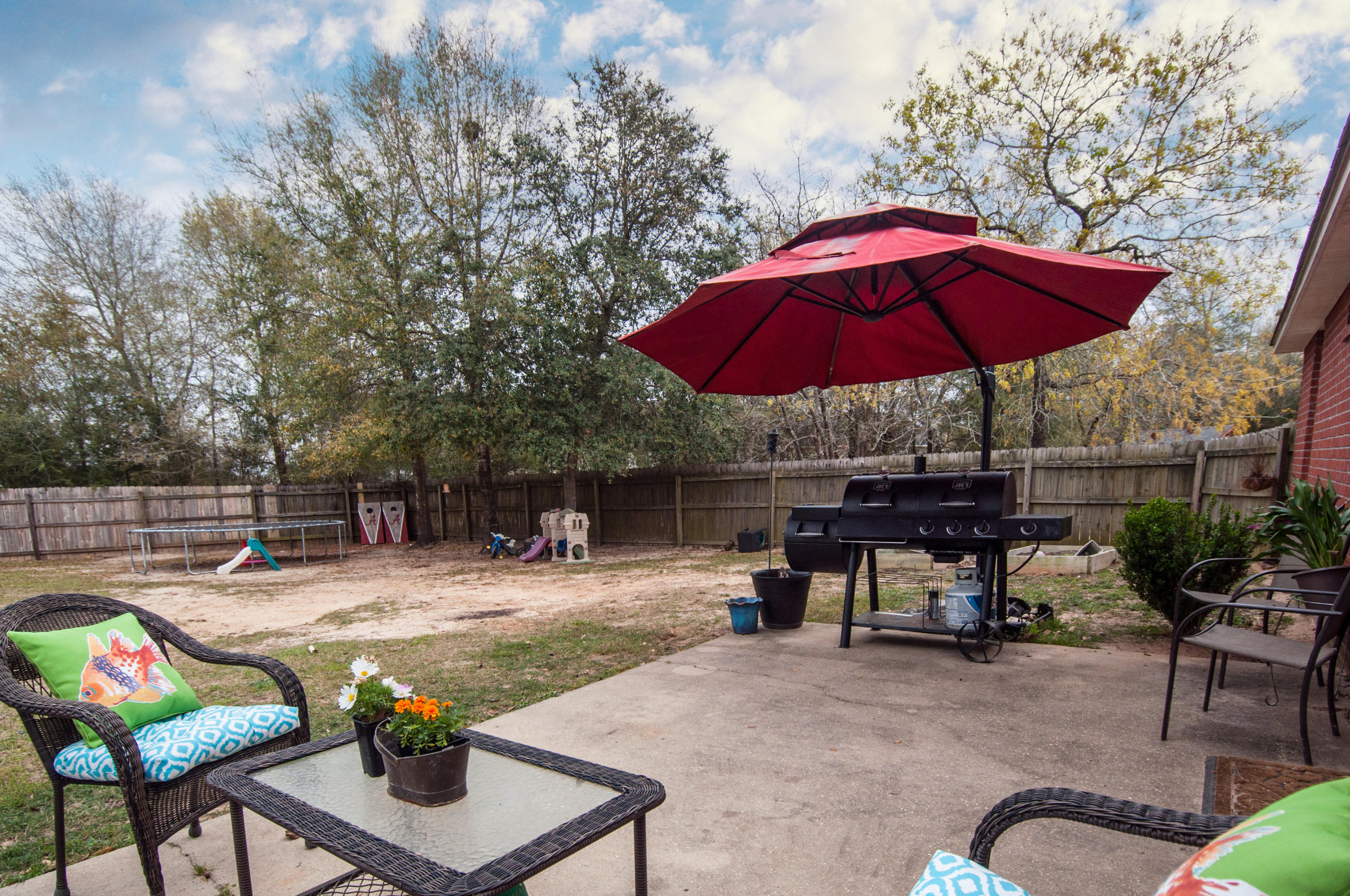 210 Limestone Circle Crestview, FL 32539 - Photo 51 of 54 a view of backyard with outdoor seating and trees