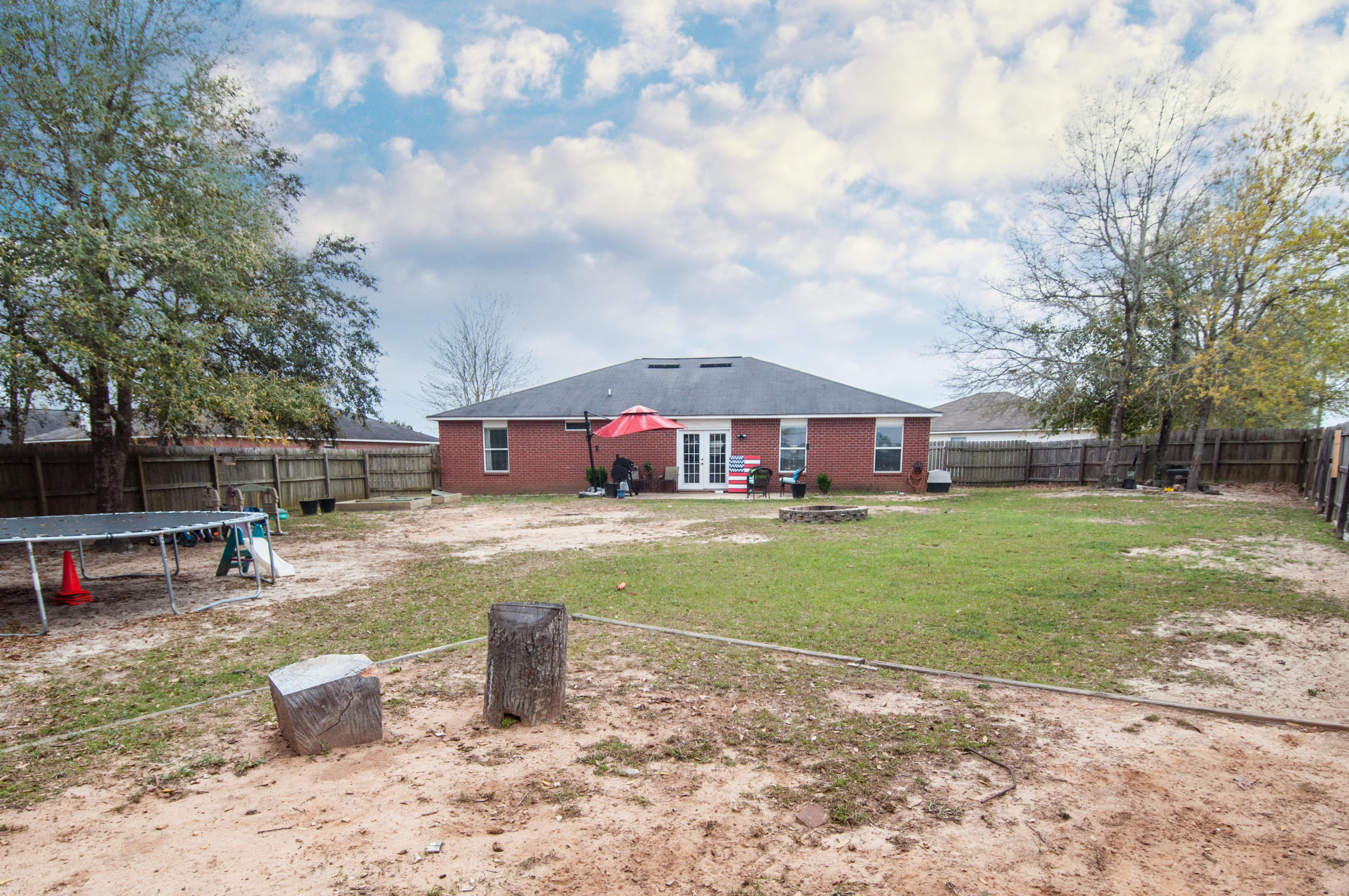 210 Limestone Circle Crestview, FL 32539 - Photo 53 of 54 a front view of a house with garden