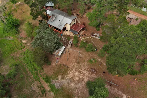 an aerial view of residential house with outdoor space