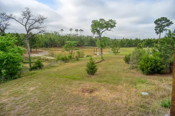 a view of a lake with a big yard
