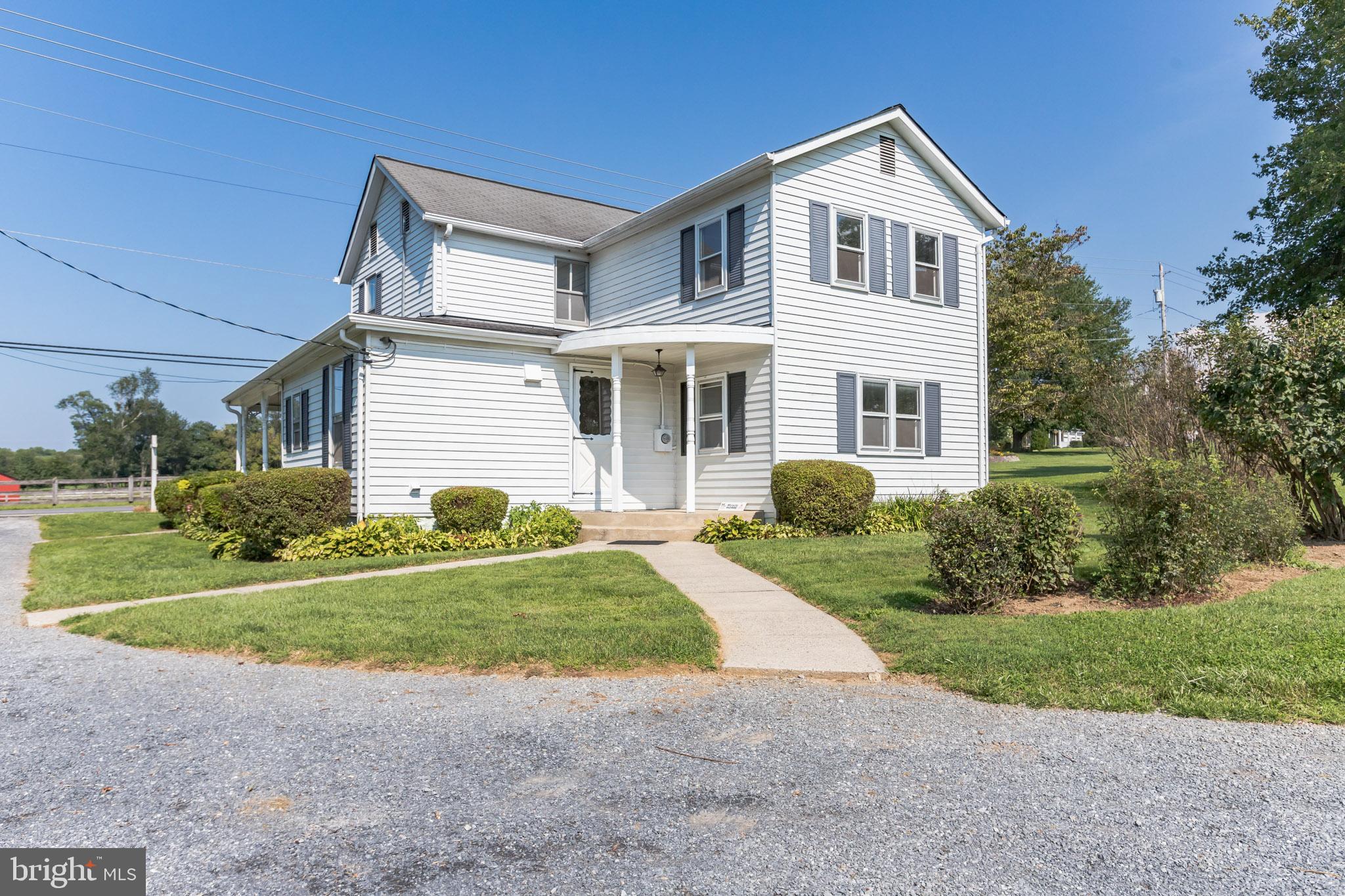 28814 Kemptown Road Damascus, MD 20872 - Photo 6 of 49 a front view of a house with a yard