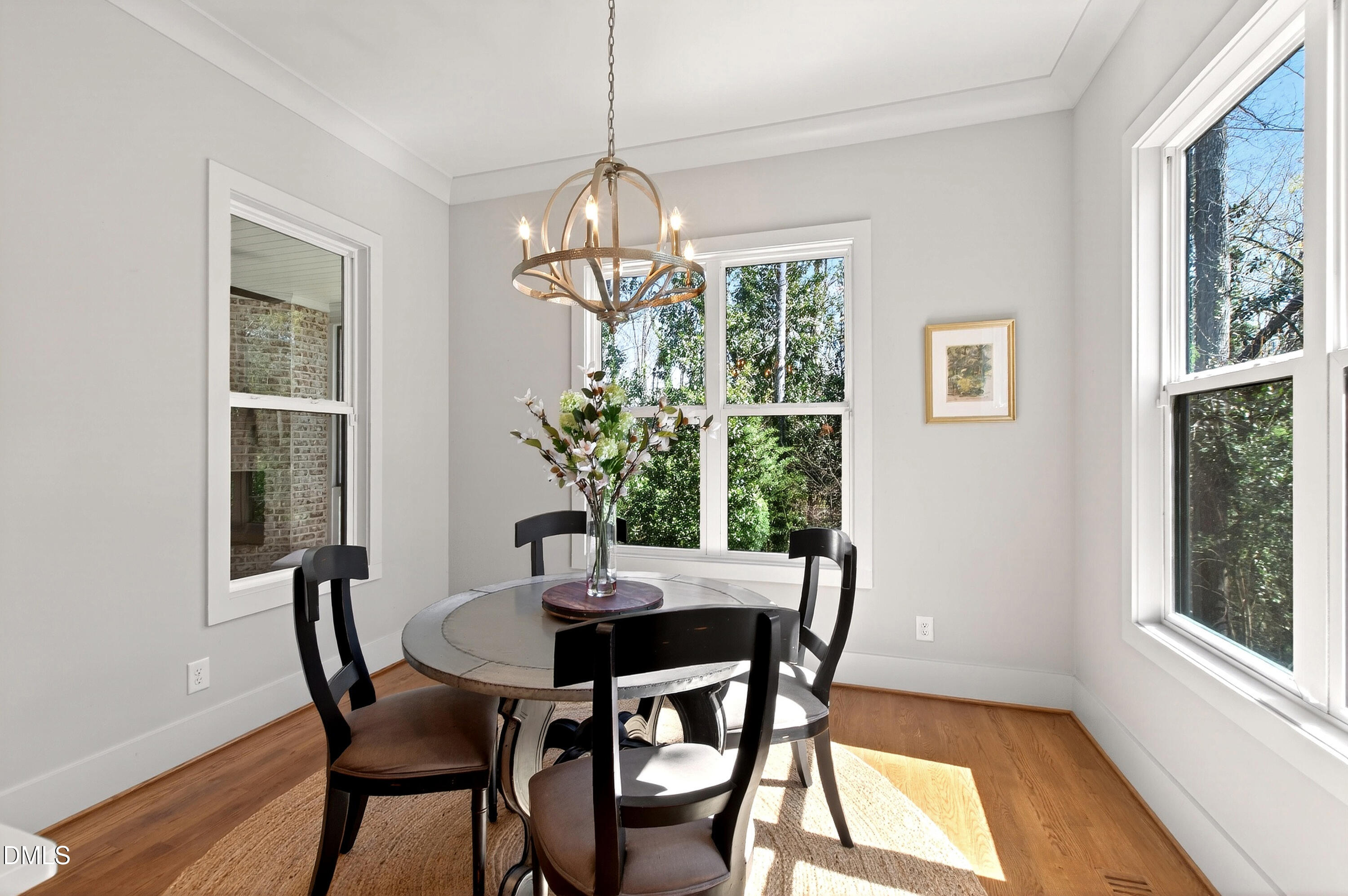 1116 Hymettus Court Raleigh, NC 27607 - Photo 19 of 69 a view of a dining room with furniture window and wooden floor