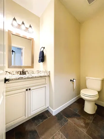 a view of hallway with wooden floor