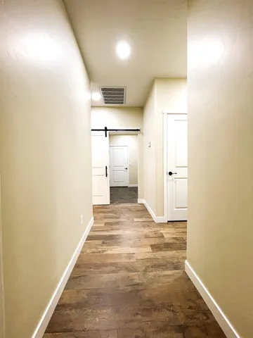 a living room with furniture a couch and a chandelier