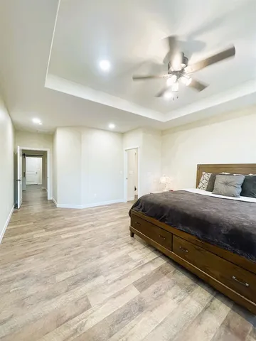 a spacious bathroom with a granite countertop double vanity sink mirror and