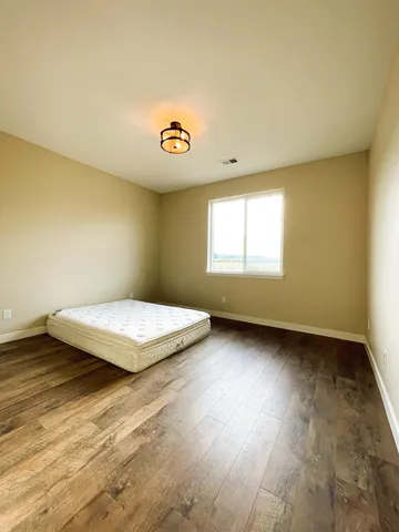 a bedroom with a bed and a table
