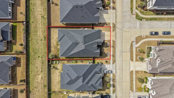 an aerial view of residential building with ocean view