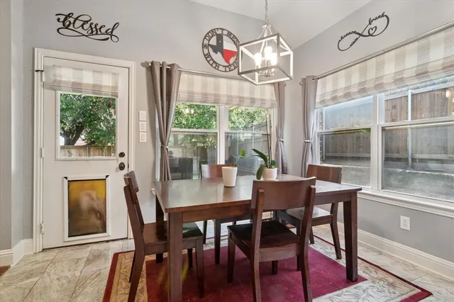 a view of a room with gym equipment and a large window