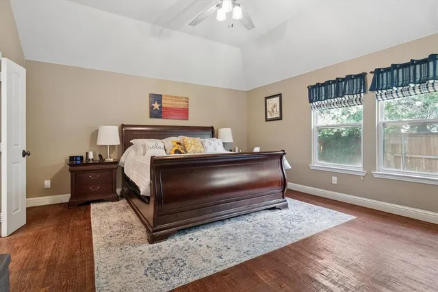 a bedroom with a bed and window